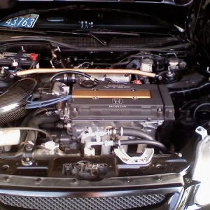 Random shot of my engine bay before it was stolen. It's also the only picture I have. I know things are a little cluttered. It's not noticeable but I just cleaned everything in the engine bay by hand.