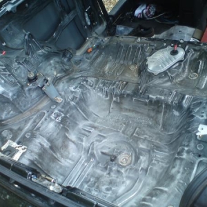 sanding down the boot after sound deadening removed.