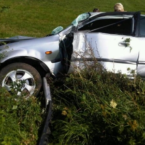 You can see on the passenger side door where we hit the post of a sign at high speed, it was like hitting a very large baseball bat.