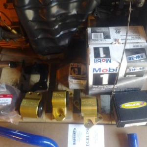 Oem type r crank pulley, blackworks radiator hoses, skunk2 vtec solenoid, gold hasport ekstk mounts.