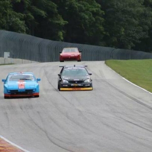 Battling with Spec 944s down into turn 5 at Road America